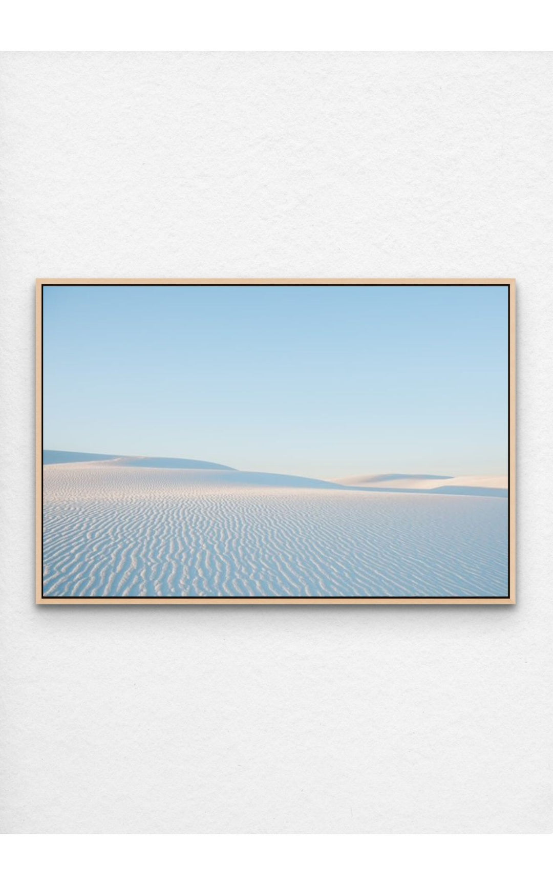 Soft ripples in the pristine dunes of White Sands, NM under a pastel sky.