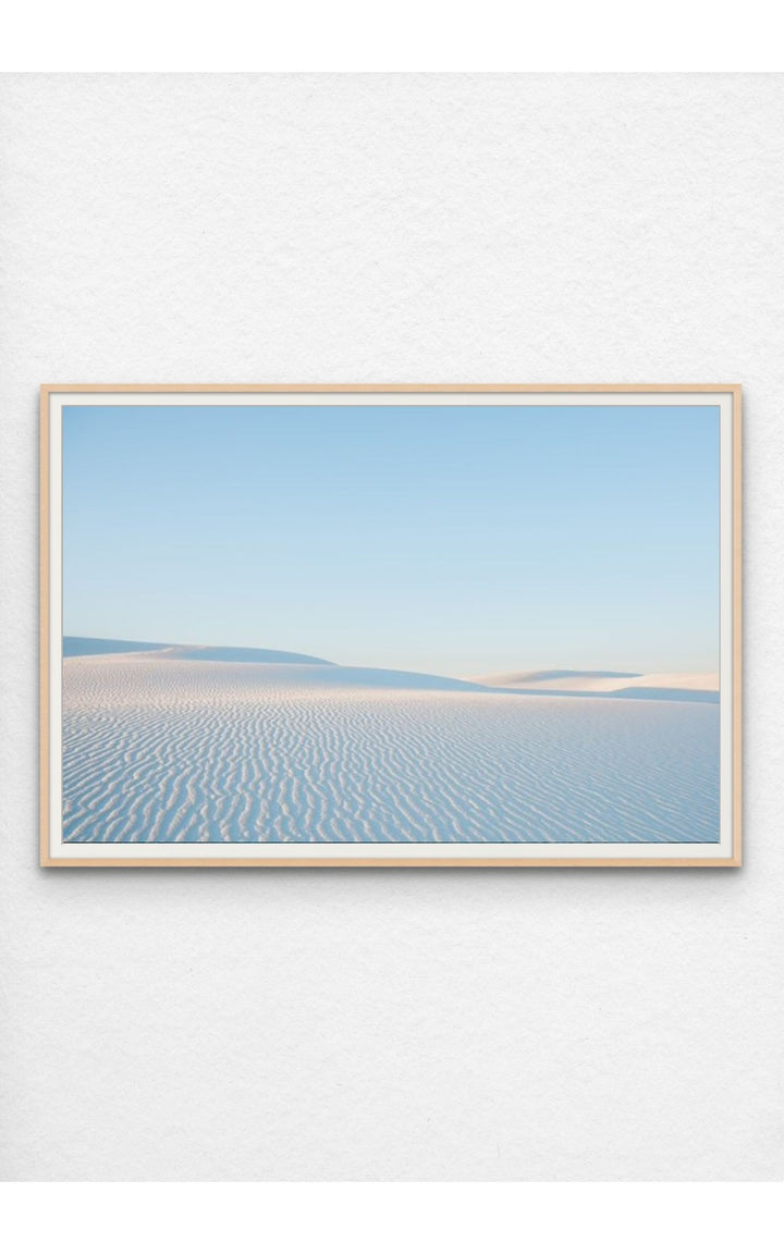 Soft ripples in the pristine dunes of White Sands, NM under a pastel sky.