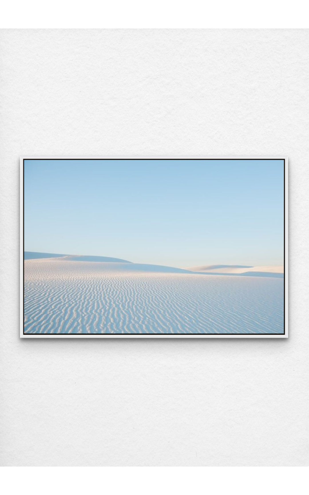 Soft ripples in the pristine dunes of White Sands, NM under a pastel sky.