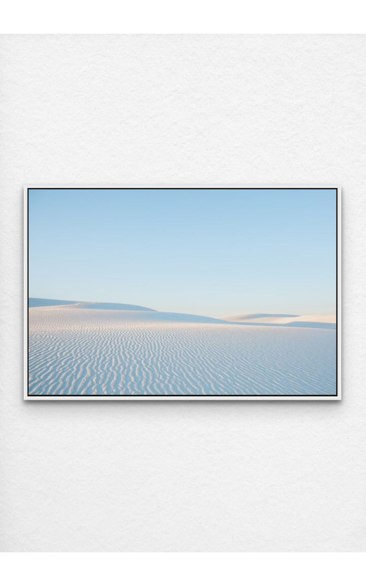 Soft ripples in the pristine dunes of White Sands, NM under a pastel sky.