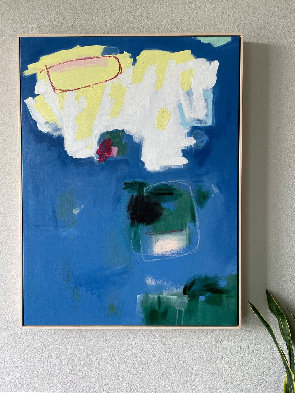 Abstract blue, green, white, and yellow painting titled Playground installation view- Artly International