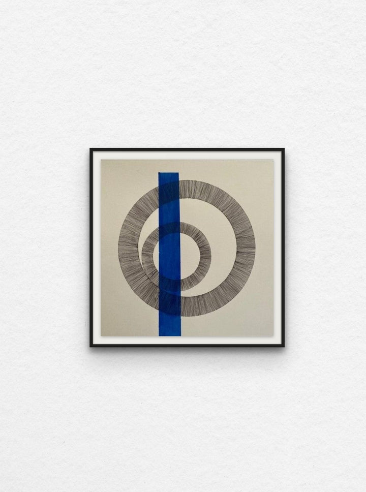 Ink drawing on paper with blue acrylic shape floated in black frame.