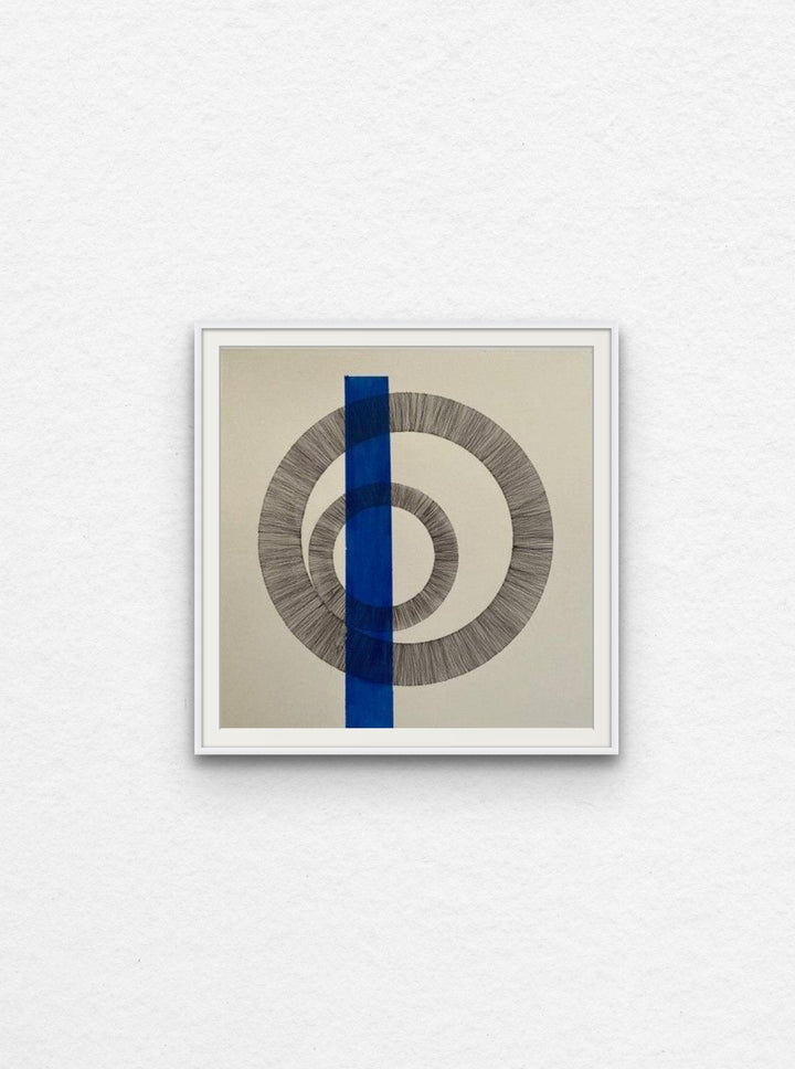 Ink drawing of two circles with blue acrylic shape floated in white frame.