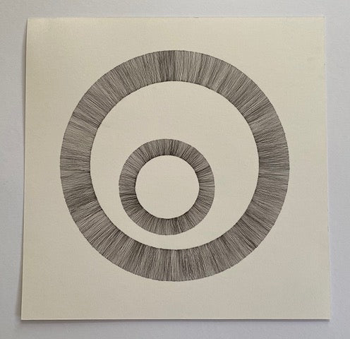 Ink drawing of two circles.