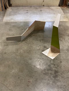 Two wood minimalist sculptures.