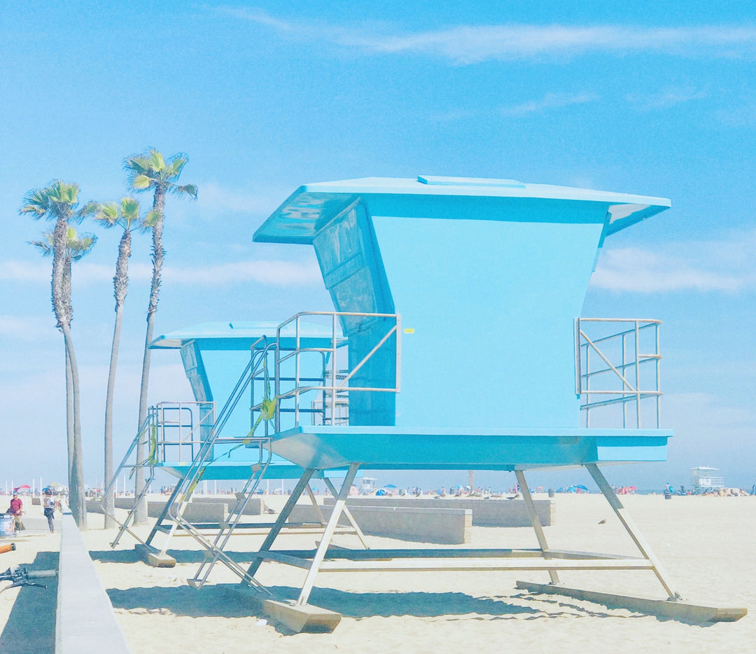 high key coastal photography. Lifeguard stands on Huntington Beach, California.