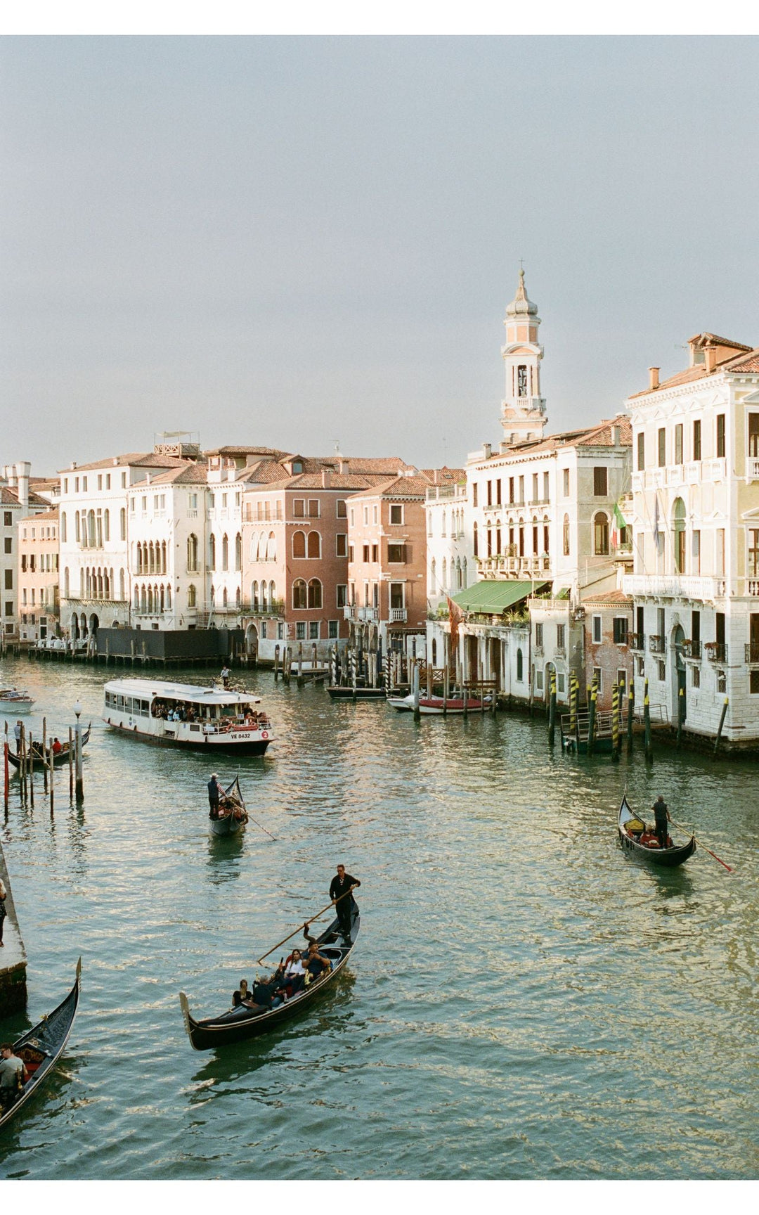 Venice Canal's gondolas and architecture in warm tones.