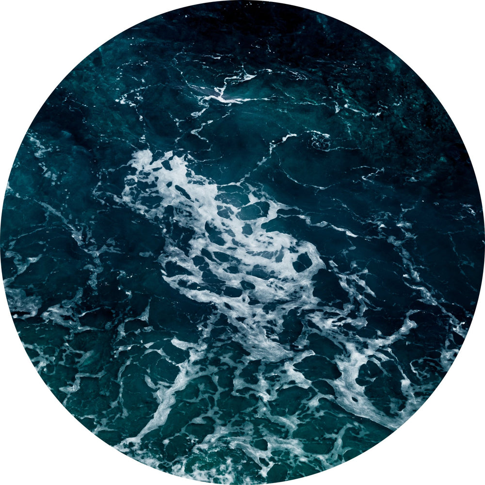 Ripples and delicate whitecap waves dominate the tondo photograph.