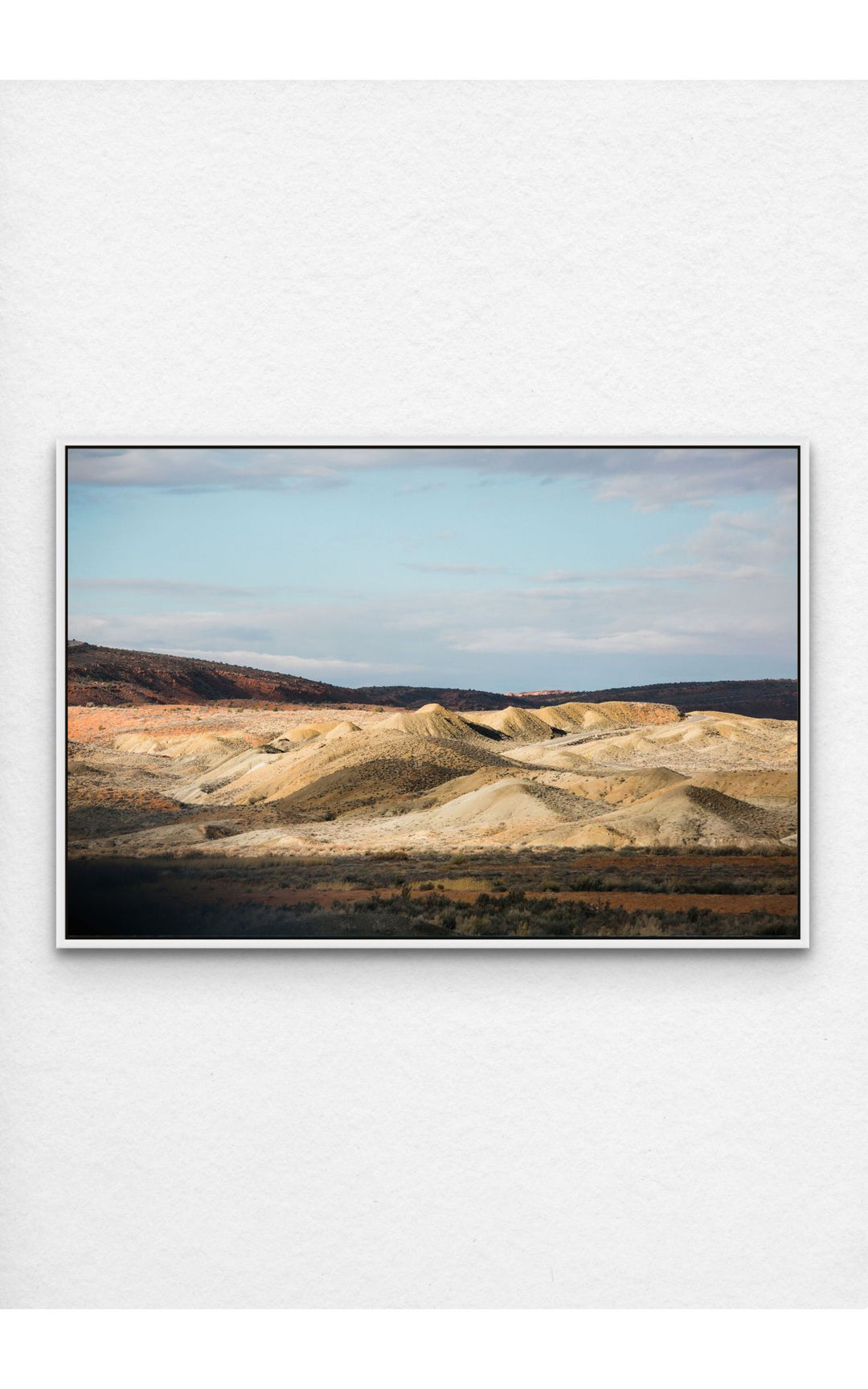 Photograph of desert landscape in Moab, Utah framed in white.