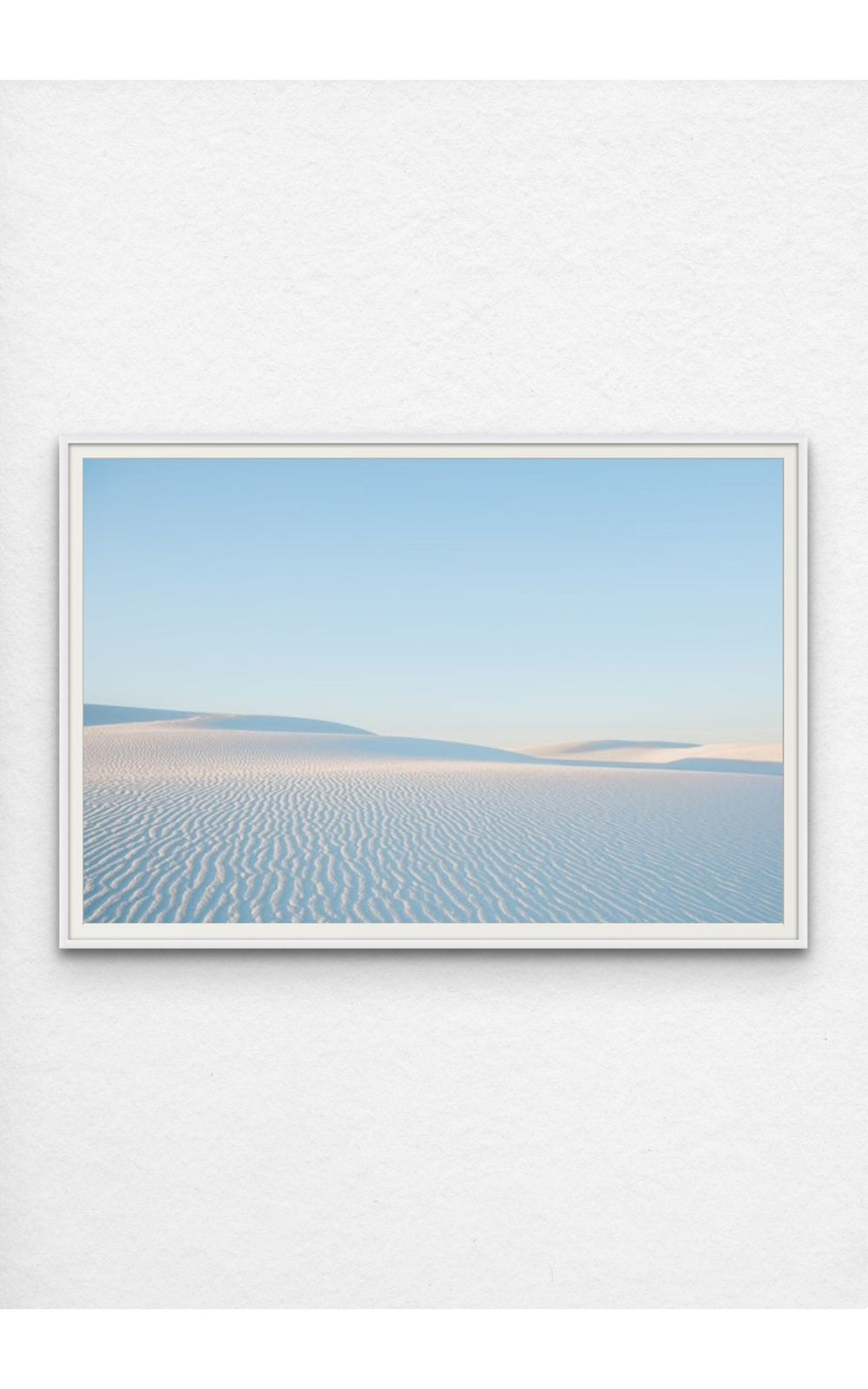 Soft ripples in the pristine dunes of White Sands, NM under a pastel sky.