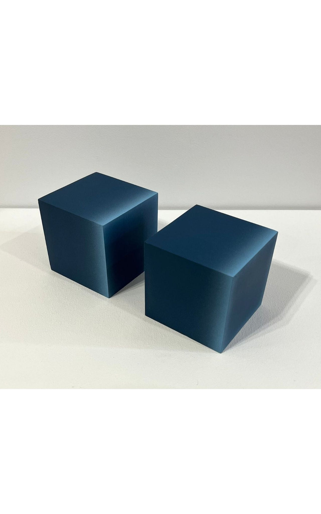 Minimalist cubes with gradient hues. Configurations vary.