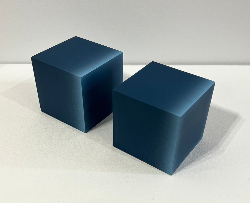 Minimalist cubes with gradient hues. Configurations vary. 