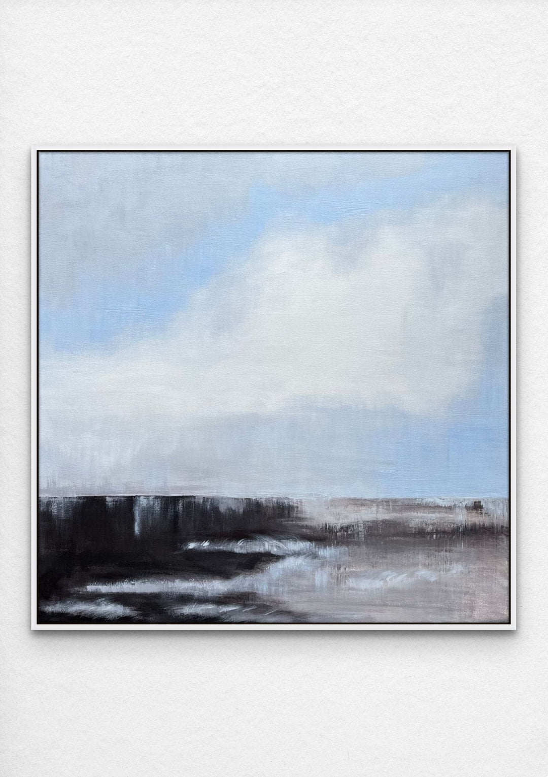 Powder blue sky with large cloud over a dark abstract landscape with white frame by Engeline Logtenberg. 