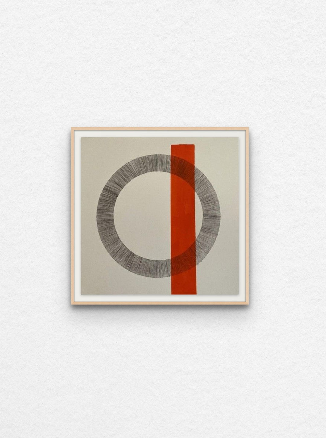Ink drawing on paper of circle with orange acrylic shape floated in maple frame. 