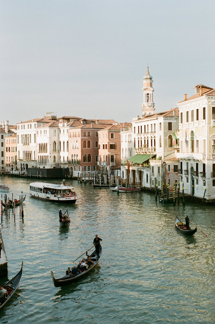 Venice Canal's gondolas and architecture in warm tones.