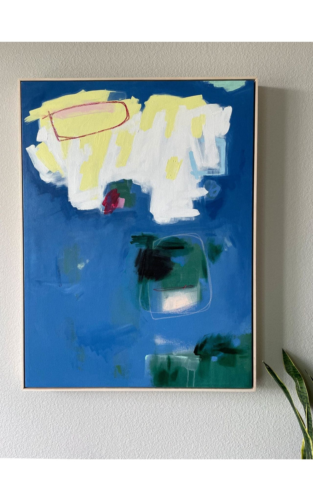 Abstract blue, green, white, and yellow painting titled Playground installation view- Artly International