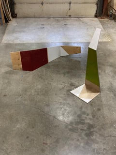Two wood minimalist sculptures.
